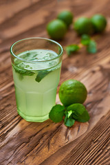 Fresh drink photo of home made limonade on wooden background