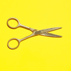 design photo of scissor on vivid yellow background