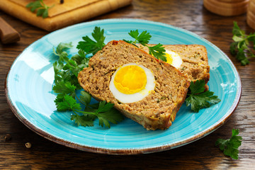 Baked meat loaf with eggs for Easter holiday.