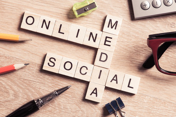 Conceptual media keywords on table with elements of game making 