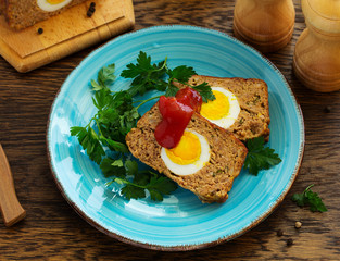 Baked meat loaf with eggs for Easter holiday.