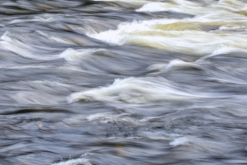 The water with the waves in the rapids, background
