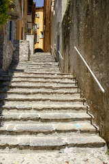 Fototapeta na wymiar steep stair in narrow alley at Varenna, Italy