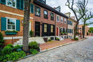 Historic brick row houses on a cobblestone street in Society Hill, Philadelphia, Pennsylvania.