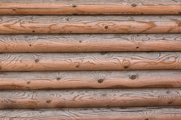 The wall of a wooden house from calibrated logs