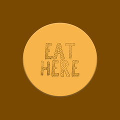 Writing eat here on yellow and brown background