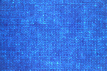 Blue textile background. A saturated blue glowing background.