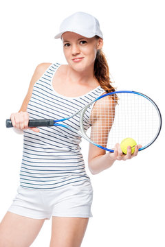 Vertical portrait of a slender tennis player in a cap with a racket isolated