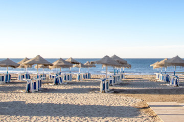 Morning beach Malaga Spain blue sea and beach umbrellas