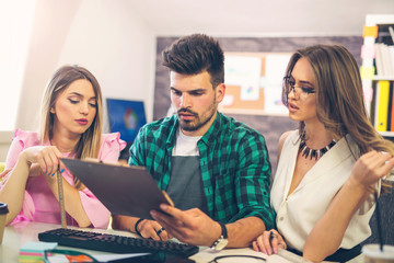 Business team discuss business ideas in front of the computer