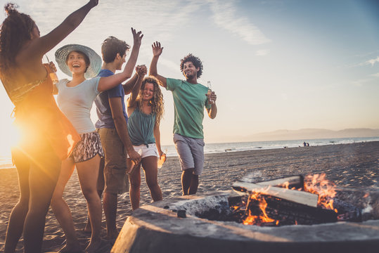 Friends partying on the beach