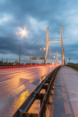 Fototapeta na wymiar Car light trails on modern bridge during storm - Warsaw, Siekierkowski bridge