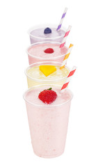 Four Flavors of Fruit Milkshakes or Yogurt Smoothies on White Background