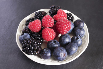 natural wild berries, raspberries, blueberries and blackberries
