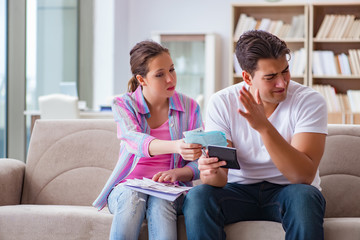 Young family discussing family finances