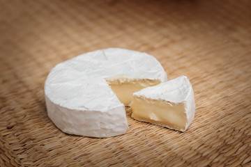 Fresh slice of Camembert cheese natural