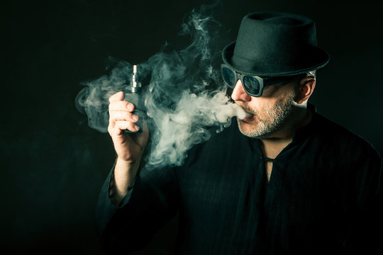 Viper will make an electronic cigarette. Thick smoke around the man. .addiction