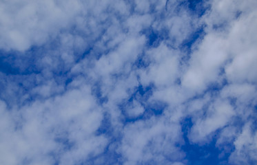 White clouds in deep blue sky