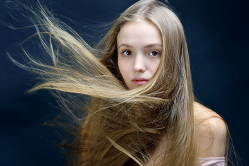 Beautiful woman with flying long hair.