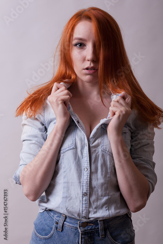 Amazing Busty Redhead Woman In Studio Photo On Gray Background Sexuality And Sensuality Attractive Amazing Busty Redhead Woman In Studio Photo On Gray Background Sexuality And Sensuality Attractive