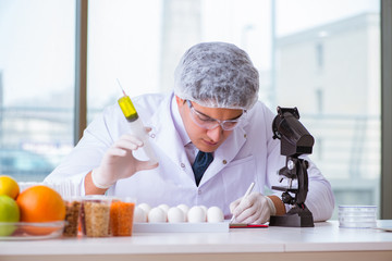 Nutrition expert testing food products in lab