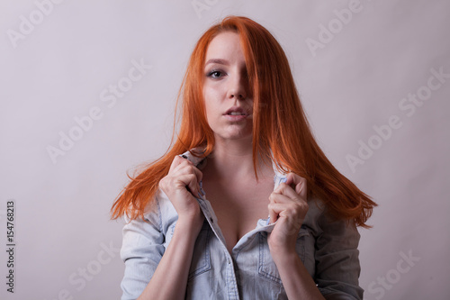 Amazing Busty Redhead Woman In Studio Photo On Gray Background Sexuality And Sensuality Attractive Amazing Busty Redhead Woman In Studio Photo On Gray Background Sexuality And Sensuality Attractive