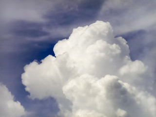 Puffy white clouds in deep blue sky