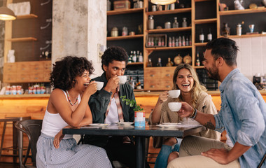 Diverse group of friends enjoying coffee together
