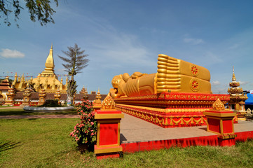 Buddhist  temple  Pha That Luang with Lying Buddha  in Vientiane in Laos

