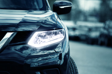 Head lamp and grill of black car