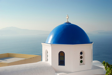 Iconic blue domed church in Santorini Greece