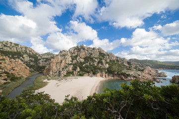 Amazing seascape of a turquoise sea in Italy. Beautiful wild beach of the Emerald coast in Sardinia..