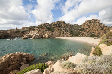 Amazing seascape of a turquoise sea in Italy. Beautiful wild beach of the Emerald coast in Sardinia..