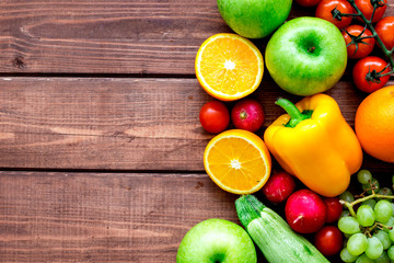 fruits and vegetables for healthy dinner on wooden background top view mock up