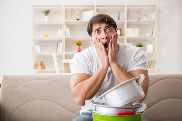 Man at home dealing with neighbor flood leak