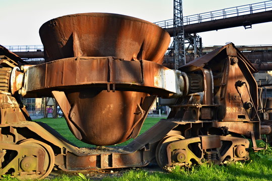 Old rusty cup for casting steel on a rail vehicle