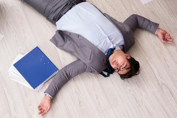 Businessman dead on the office floor
