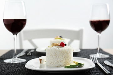 Plate with delicious tasty coconut rice on table