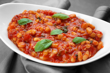 Plate with delicious Italian butter beans on napkin