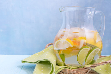 Lemonade pitcher with lemon, orange, lime slices