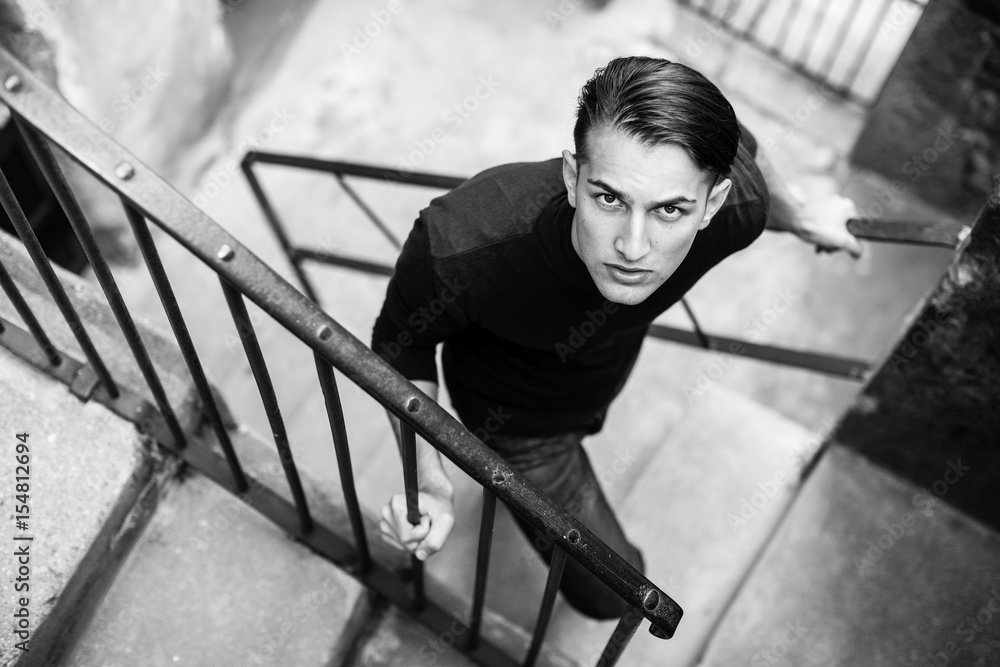 Wall mural handsome young man, fashionable black and white portrait.