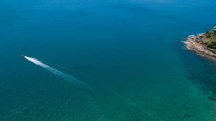 Aerial view of tropical island clear blue sea