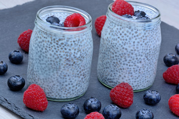 Chia seeds pudding with raspberry and blueberry