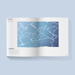 Open magazine book with water in the middle page