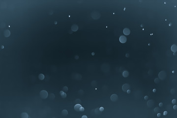 Bokeh Background Very dark desaturated blue.