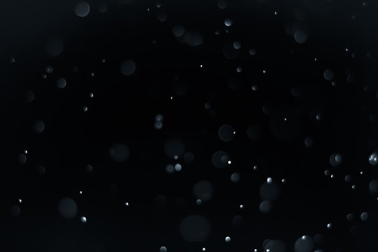 Bokeh Background  Very dark (mostly black) blue.