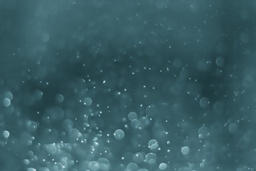 Bokeh Background Very dark desaturated cyan.