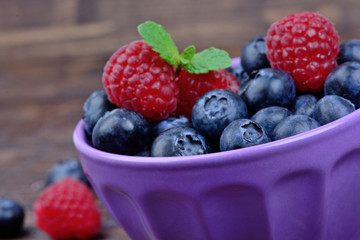 Ceramic bowl with blueberries and raspberries