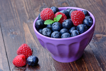 Healthy fruits in a bowl on table