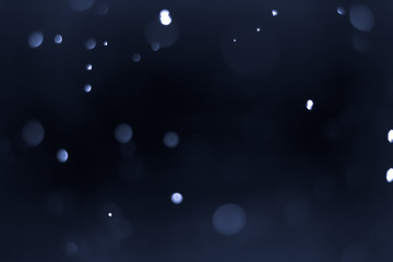 Bokeh Background Very dark (mostly black) blue.